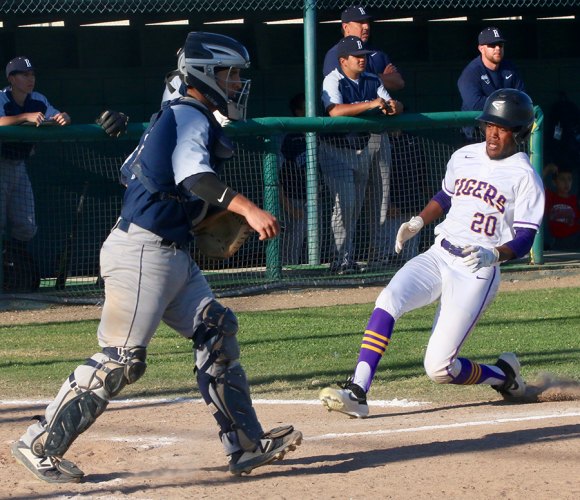 Lemoore's Ozzie Hernandez scored the Tigers only run Friday as his team lost a 12-1 decision to visiting Redwood.